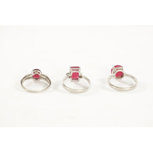 316 - A COLLECTION OF THREE RUBY RINGS WITH CERTIFICATES the 4.96ct octagonal ruby on silver shank, ring s... 