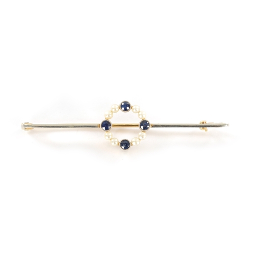 320 - A 15CT GOLD SAPHIRE AND PEARL BAR BROOCH Total weight app. 3.7g. (58mm overall)