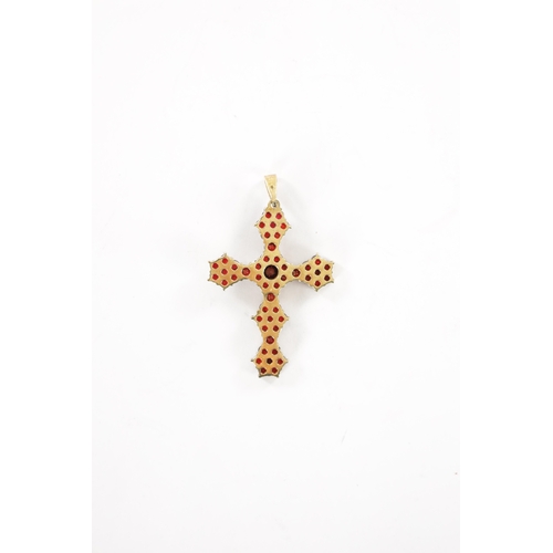 326 - A 9CT GOLD GARNET SET CROSS PENDANT With claw setting and loop suspension. Total weight app. 4.2g (4... 