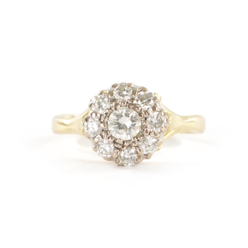 327 - AN 18CT GOLD NINE STONE DIAMOND DAISY RING Total weight, 3.4g. Ring size M/N