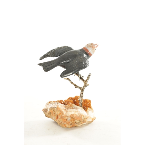 330 - A FINE 20TH CENTURY CARVED HARD STONE SCULPTURE OF A BIRD IN THE MANNER OF FABERGE mounted on a ster... 