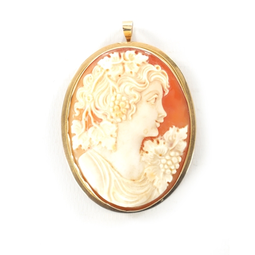 334 - A LARGE 19TH CENTURY 9CT GOLD CAMEO BROOCH depicting a bust of a classical lady amongst leaves and b... 