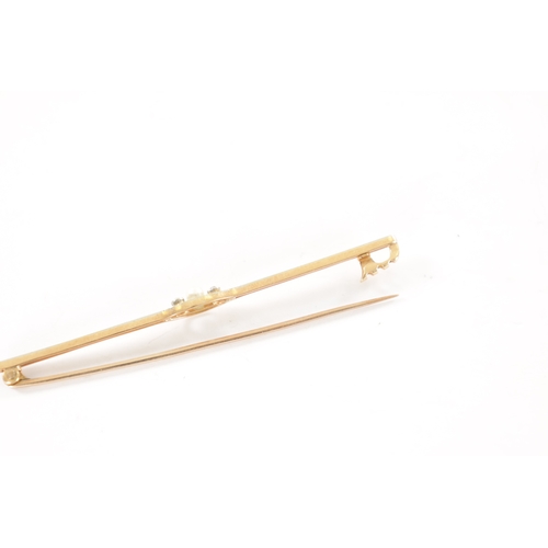 345 - A 15CT GOLD AND WHITE GOLD PEARL AND DIAMOND BAR BROOCH Total weight app. 3.4g (68mm wide)