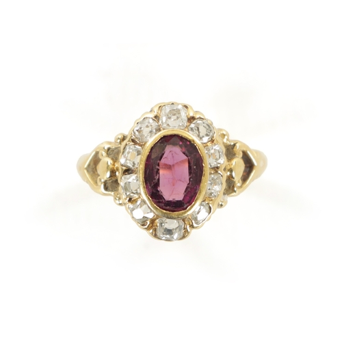 352 - A LADIES VINTAGE 18CT GOLD AMETHYST AND DIAMOND RING With oval cut amethyst surrounded by ten rose c... 