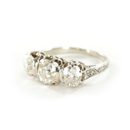 358 - A LADIES WHITE GOLD THREE STONE DIAMOND RING set with three cushion cut diamonds app. 3.2ct, colour ... 