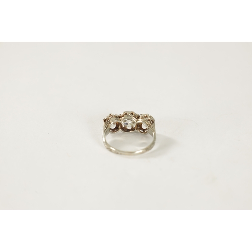 358 - A LADIES WHITE GOLD THREE STONE DIAMOND RING set with three cushion cut diamonds app. 3.2ct, colour ... 