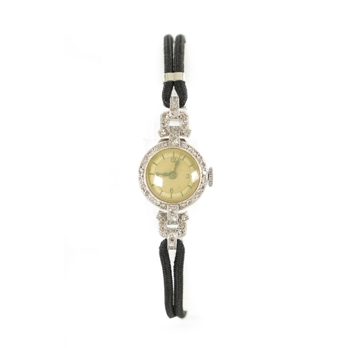 359 - A LADIES 1930’S WHITE GOLD AND DIAMOND SET COCKTAIL WATCH with a silvered Arabic dial and manual win... 