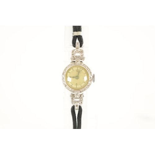 359 - A LADIES 1930’S WHITE GOLD AND DIAMOND SET COCKTAIL WATCH with a silvered Arabic dial and manual win... 