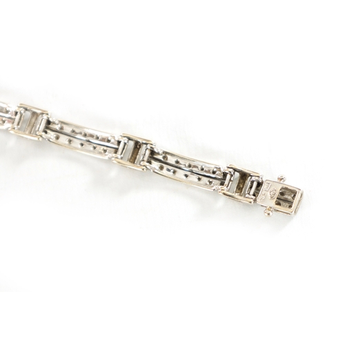 363 - AN 18CT GOLD DIAMOND SET BRACELET with double bar link each set with fourteen brilliant cut diamonds... 