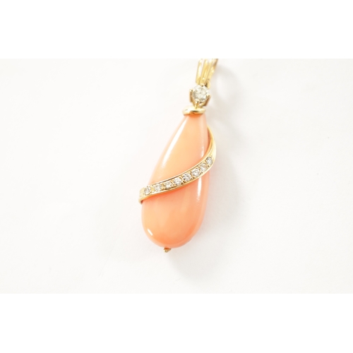 364 - A CORAL, DIAMOND AND 18CT GOLD PENDENT The coral pear drop has a gold band set with brilliant-cut di... 