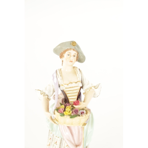 37 - A LATE 19TH CENTURY VIENNA STYLE PORCELAIN FIGURE of a standing female flower seller. (16cm high)