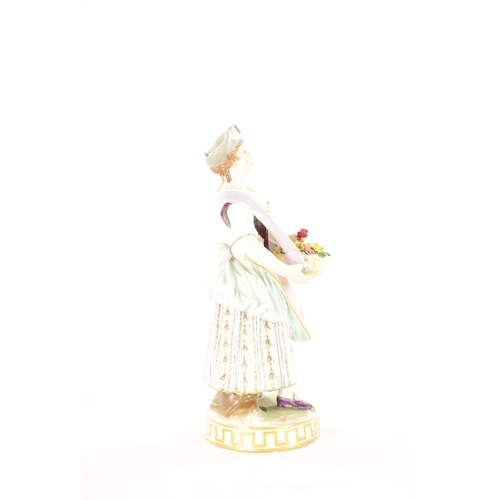 37 - A LATE 19TH CENTURY VIENNA STYLE PORCELAIN FIGURE of a standing female flower seller. (16cm high)