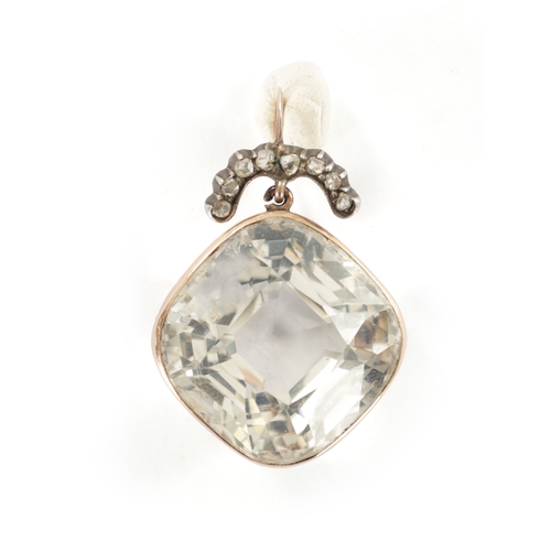 372 - A LARGE VINTAGE GOLD MOUNTED CHRYSTAL AND DIAMOND PENDANT the square cut crystal suspended by a hoop... 