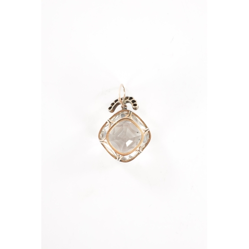 372 - A LARGE VINTAGE GOLD MOUNTED CHRYSTAL AND DIAMOND PENDANT the square cut crystal suspended by a hoop... 