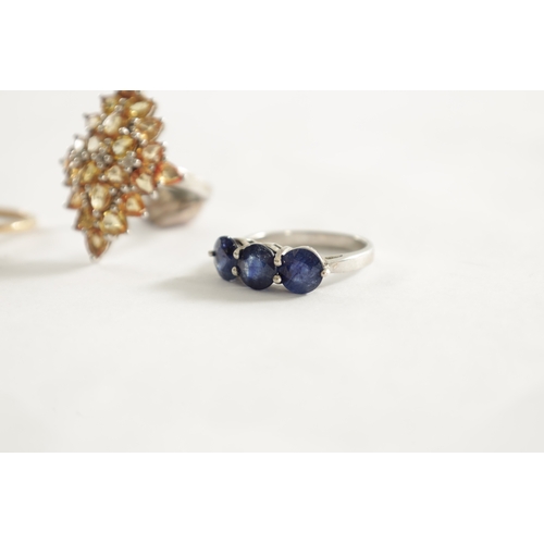 374 - A COLLECTION OF THREE LADIES RINGS, a three-stone sapphire and silver ring with certificate, 5.94ct,... 