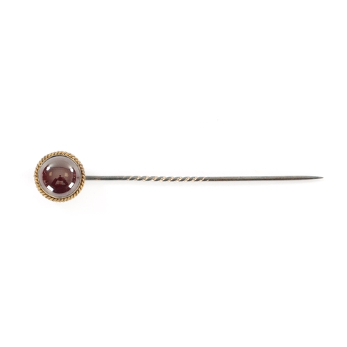 375 - A GOLD MOUNTED CABOCHON GARNET PIN BROOCH In original Moroccan leather box (7.8cm overall)