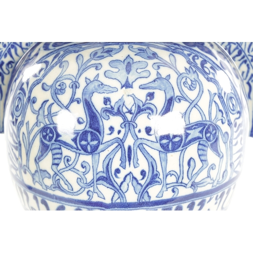 38 - A LATE 19TH CENTURY FRENCH ALHAMBRA EARTHENWARE BLUE AND WHITE VASE having deer set amongst leaf des... 