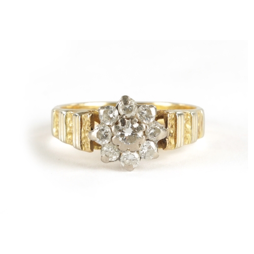 382 - AN 18CT GOLD NINE STONE DIAMOND CLUSTER RING, total weight app. 4.3g, ring size N.