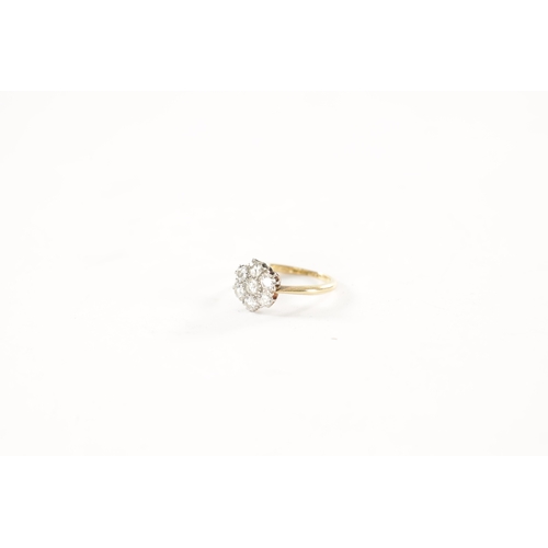 386 - AN 18CT GOLD SEVEN STONE DIAMOND DAISY RING, total weight app. 2.3g, ring size J/K.