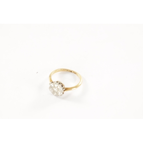 386 - AN 18CT GOLD SEVEN STONE DIAMOND DAISY RING, total weight app. 2.3g, ring size J/K.