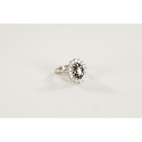 387 - AN 18CT WHITE GOLD SAPPHIRE AND DIAMOND RING with a navette cut centre diamond surrounded by eight b... 