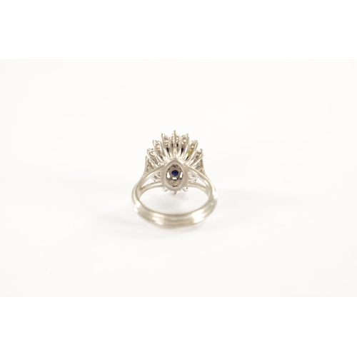 387 - AN 18CT WHITE GOLD SAPPHIRE AND DIAMOND RING with a navette cut centre diamond surrounded by eight b... 