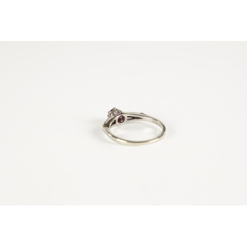 388 - AN 18CT WHITE GOLD RUBY AND DIAMOND RING. Total weight app. 2.3g, ring size M/N