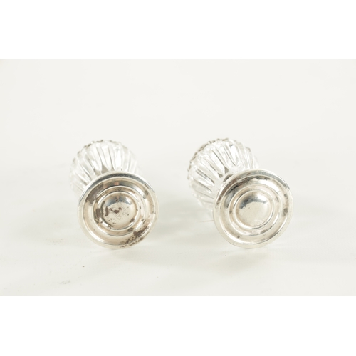 393 - TWO SILVER TRINKET DISHES AND A PAIR OF SILVER MOUNTED GLASS SHAKERS (11cm diameter)