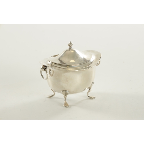 394 - A SMALL EDWARDIAN SILVER FOOTED OVAL LIDDED TEA CADDY with flared shaped top rim, two ring handles r... 