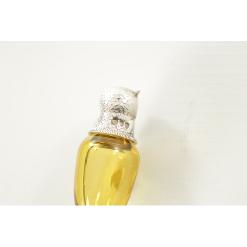 398 - A FINE VICTORIAN SILVER MOUNTED AMBER GLASS OWL SCENT BOTTLE the cone shaped body with finely sculpt... 