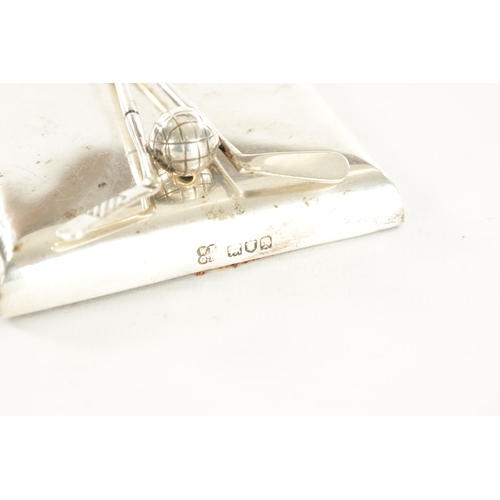 399 - AN EDWARDIAN SILVER GOLFING LETTER CLIP with weighted rectangular base and sprung clip modelled as t... 