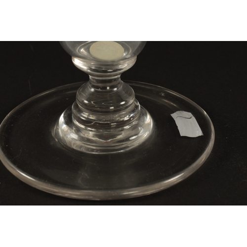 4 - A LARGE LATE 19TH CENTURY GLASS COIN GOBLET the knopped stem enclosing a silver coin dated 1877, rai... 