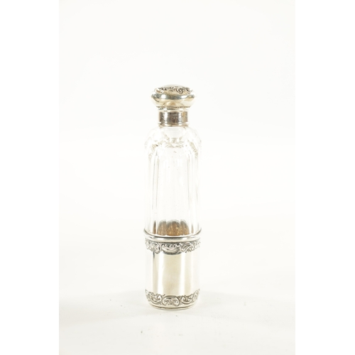 402 - AN EDWARDIAN SILVER-MOUNTED CUT GLASS HIP FLASK (14cm high)