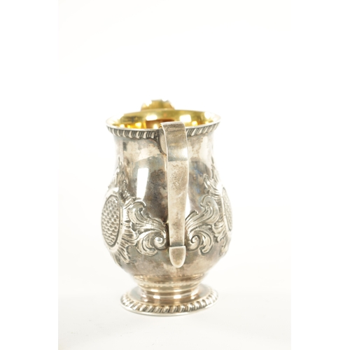 408 - A TIFFANY AND CO 550 BROADWAY SILVER MILK JUG with gadroon rims, gilt interior and embossed leafing ... 