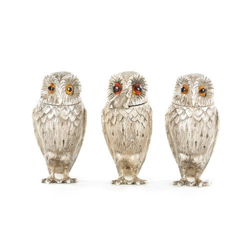 409 - A SET OF SILVER NOVELTY OWL CONDIMENTS BY GARRARD & CO. all with inset amber glass eyes, hinged head... 