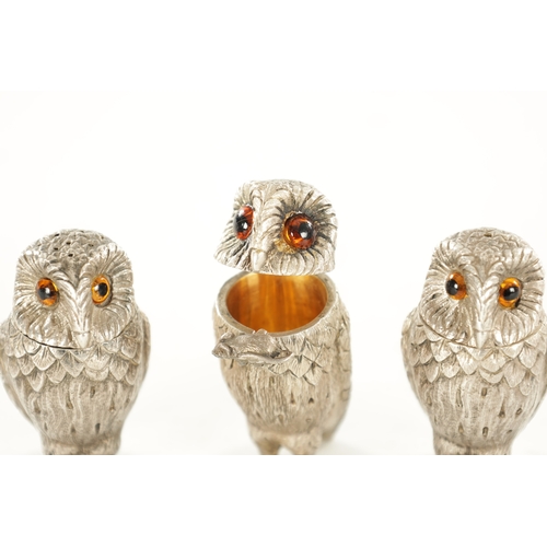 409 - A SET OF SILVER NOVELTY OWL CONDIMENTS BY GARRARD & CO. all with inset amber glass eyes, hinged head... 