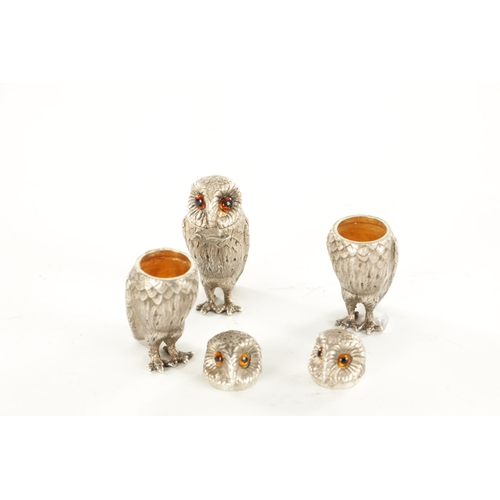 409 - A SET OF SILVER NOVELTY OWL CONDIMENTS BY GARRARD & CO. all with inset amber glass eyes, hinged head... 