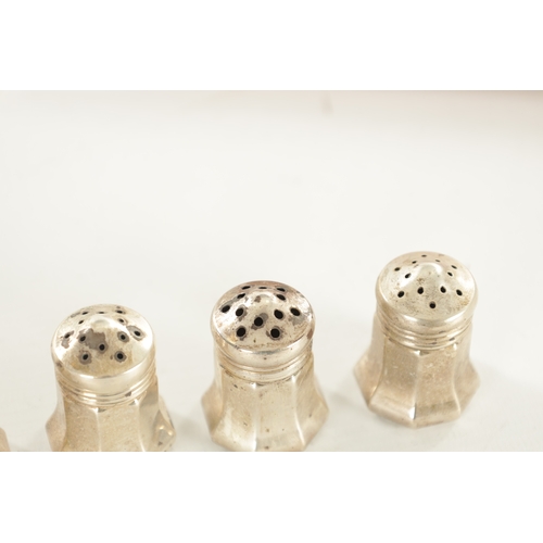 415 - A CASED SET OF EIGHT CARTIER STERLING SILVER SALTS of bulbous form with faceted bodies and screw top... 