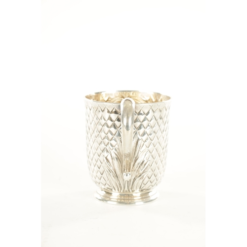 422 - A VICTORIAN SILVER FOOTED MUG with chequered diamond body and scroll handle by Edward Ker Reid, Lond... 