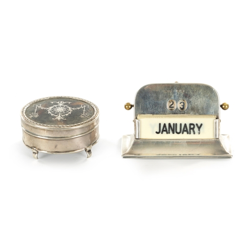 428 - A GEORGE V SILVER DESK CALENDER AND TORTOISESHELL JEWELLERY BOX with revolving date aperture and ivo... 