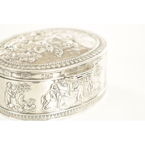 443 - A SMALL 19TH CENTURY DUTCH SILVER OVAL TRINKET BOX embossed with figural farming scenes to the rim, ... 