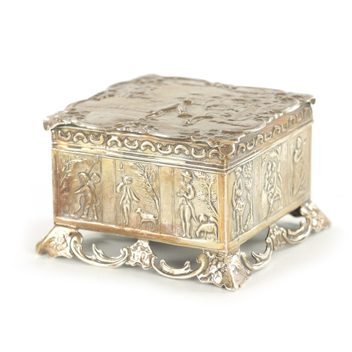 449 - A LATE 19TH CENTURY DUTCH SILVER BOX embossed with classical farming scenes to the edges and hunting... 