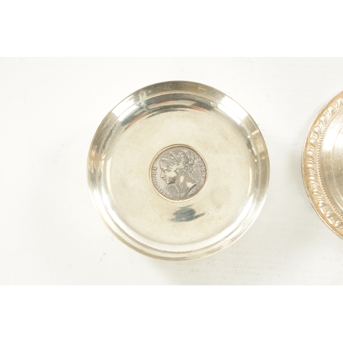 454 - A PAIR OF STERLING SILVER SHORT CIRCULAR BASE CANDLESTICKS with feathered borders and knopped stems ... 