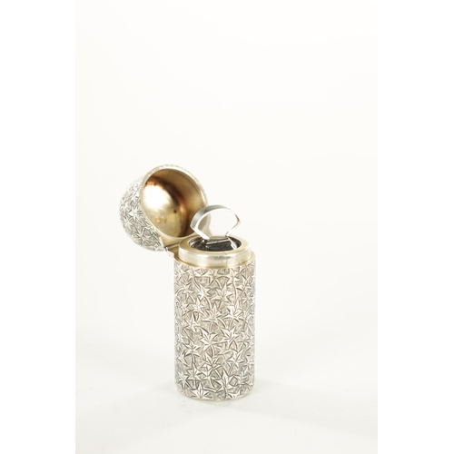 455 - A VICTORIAN BRIGHT CUT CYLINDRICAL SILVER PERFUME BOTTLE with allover interlinking leaf decoration, ... 