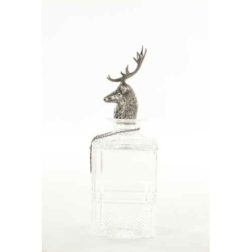 456 - A SQUARE MOULDED AND ENGRAVED SCOTCH WHISKEY DECANTER with hallmarked silver label and cast stags he... 