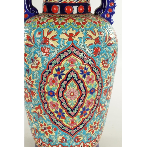 46 - A LARGE 20TH CENTURY FRENCH CERAMIC HALL VASE ATT 'LONGWY' brightly decorated with floral sprays (68... 
