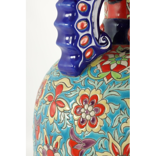 46 - A LARGE 20TH CENTURY FRENCH CERAMIC HALL VASE ATT 'LONGWY' brightly decorated with floral sprays (68... 