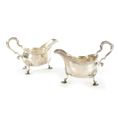 460 - A PAIR OF EARLY GEORGE III SILVER SAUCEBOATS raised on shell scroll feet with acanthus scroll handle... 