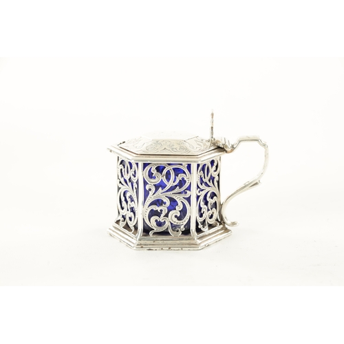 461 - A VICTORIAN SILVER AND BLUE GLASS HEXAGONAL LIDDED MUSTARD POT with pierced scroll decoration by Cha... 