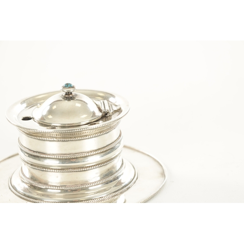 473 - AN EARLY 20TH CENTURY LIBERTY & CO SILVER INKWELL of ringed cylindrical form with beaded decoration,... 